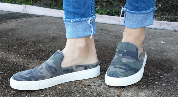 Camo print slide on shoes.