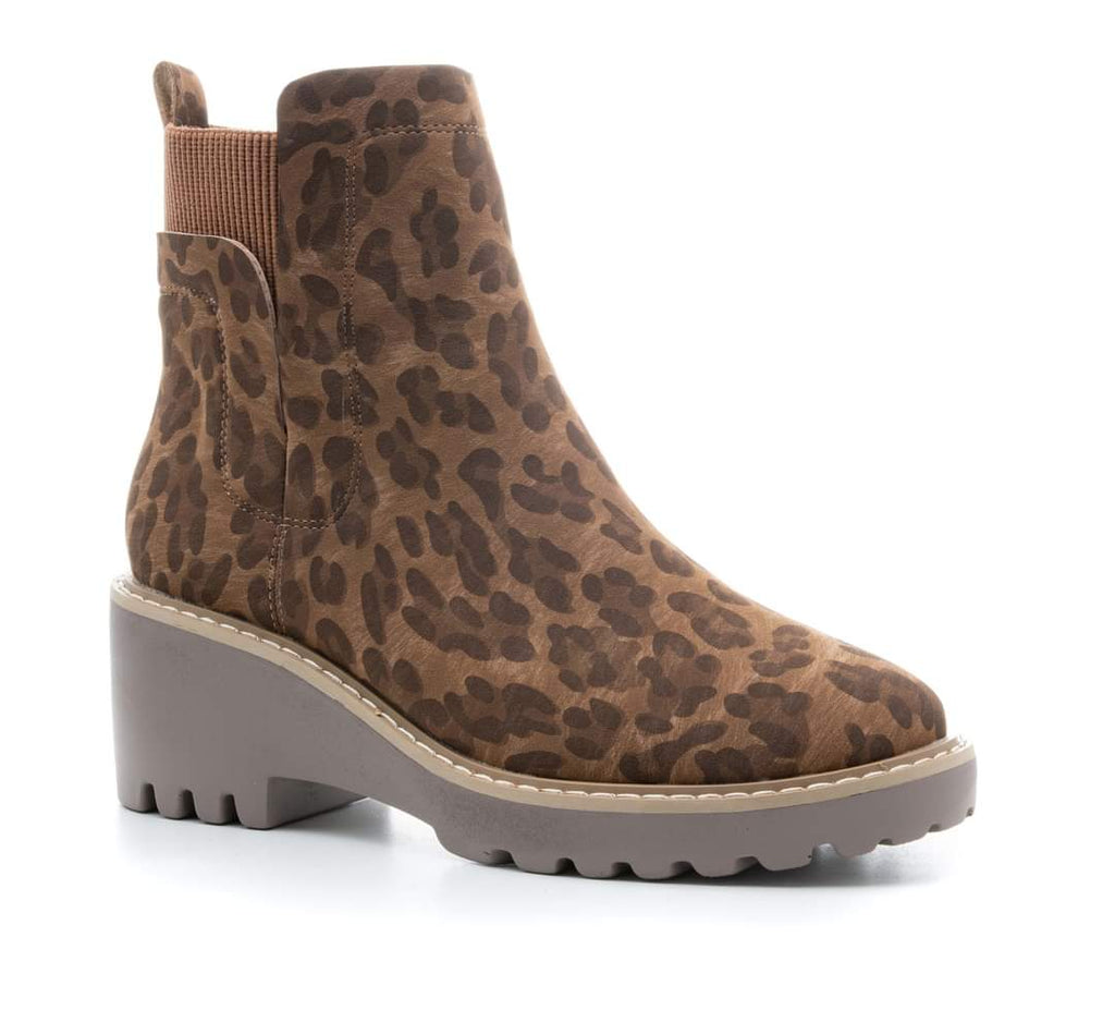 Pull on leopard print short boot with elasticized ankle and utility sole.utility sole.